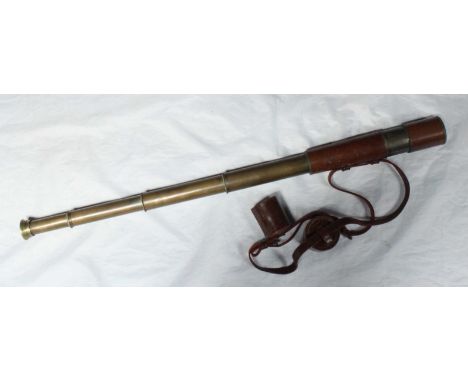 A Broadhurst & Clarkson four-draw brass field telescope, original brown leather sleeve, sliding object lens shade, strap and 