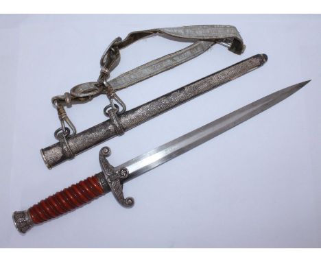 A German Reich Officer's 1935 pattern dress dagger, with oak-leaf pommel and ferrule, amber-coloured phenol grip, 10' blade m