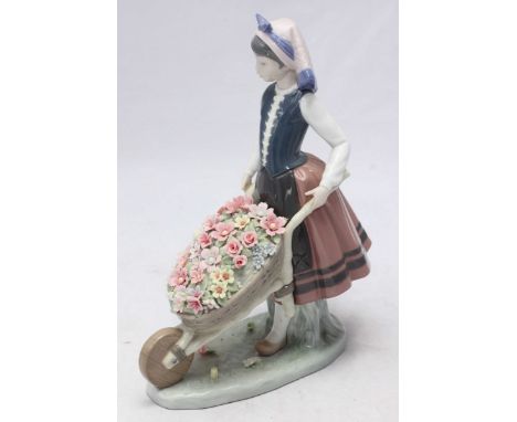 A Lladro porcelain figure 'A Barrow of Blossoms' no.1419. 26cm high.