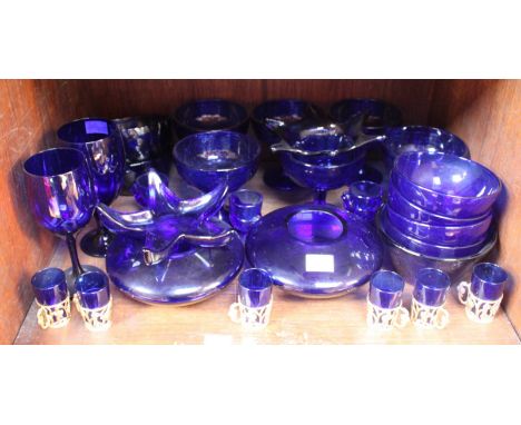 SECTIONS 41 & 42.  Two shelves of blue glasswares including glasses, bowls, trinket dishes, perfume bottles etcetera