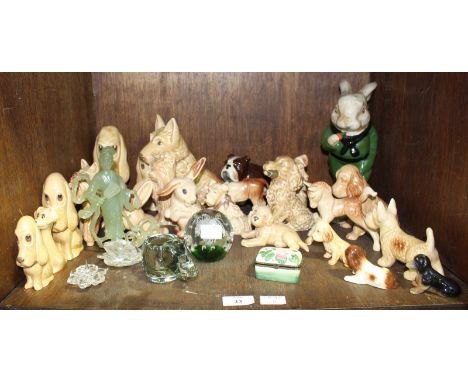 SECTION 33.  A good collection of Sylvac pottery dogs and bunnies, together with a Swarovski swan and a candlestick, various 