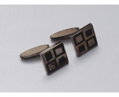 A pair of circa 1960s silver cufflinks by Georg Jensen, sterling Denmark, 87, the fronts with green geometric enamelling in a