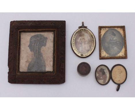 A late 18th /early 19th Century glazed oval portrait miniature/ memento-mori the front painted with two ladies in a landscape