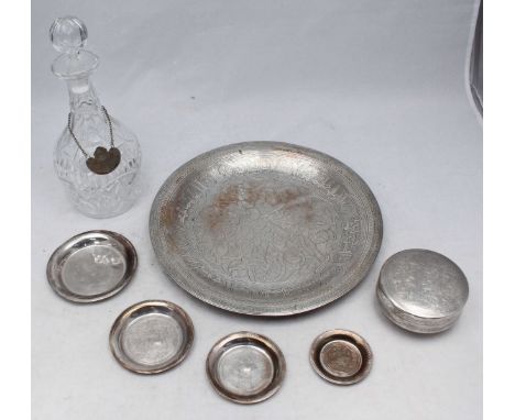 An Egyptian white-metal circular dish, 30cm, four small graduated pin dishes and a circular box and cover (all test as silver