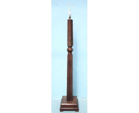 A hardwood standard lamp with horizontal reeded column