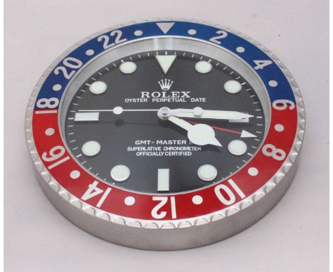 A Rolex Oyster Perpetual Date GMT/Master II Superlative Chronometer with Pepsi bezel retailer's wall clock