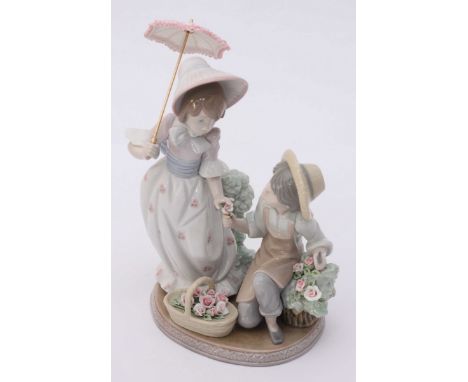 A Lladro ceramic figure-group 'For You' model number '5.453' in original box. 21cm high.