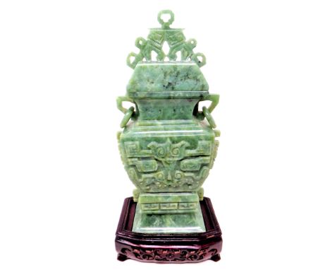 A Chinese carved jade koro on a wooden stand, height 29.5 cm 