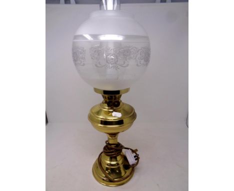 A brass oil lamp with chimney and shade (electrified)  