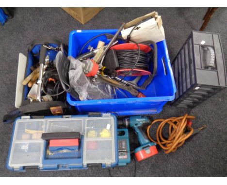 A tool bag and a tool box containing a large quantity of hand tools, hardware, power tools including Makita drill with charge