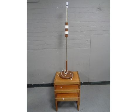 A nest of three 20th century Sunelm teak tables and a 1970's standard lamp 