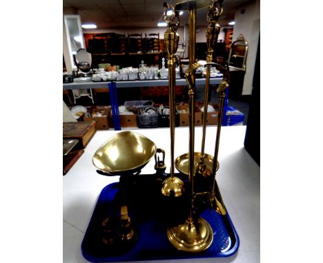 A brass four piece companion set on stand together with a set of Viking kitchen scales with graduated weights   