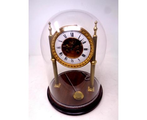 A gilt metal J W Benson eight day skeleton clock on stand under glass dome  