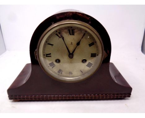 A 20th century mahogany cased mantel clock with silvered dial 