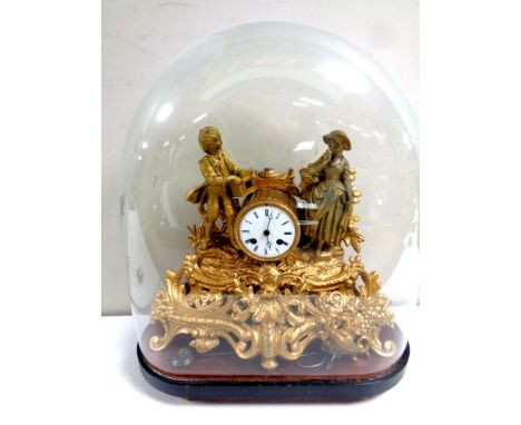 A gilt metal continental mantel clock with enamel dial, pendulum and key, under a glass dome, dome height 47.5 cm (damages) 