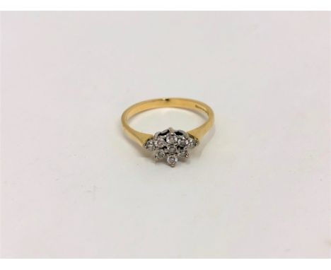 An 18ct gold diamond cluster ring, size K CONDITION REPORT: 2.1g