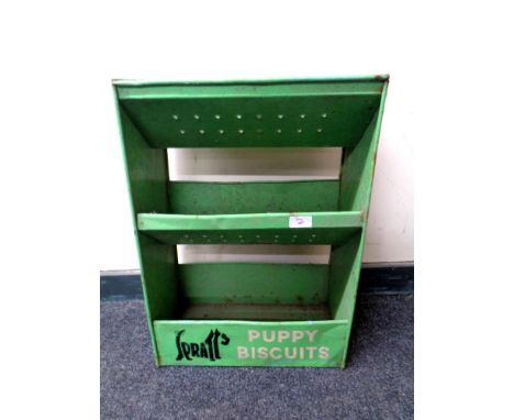 A 20th century metal shelving caddy bearing Spratts puppy biscuit advertisement  