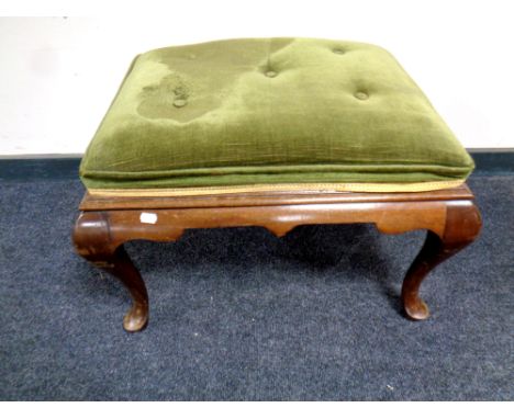 A 19th century mahogany footstool upholstered in a green button dralon 