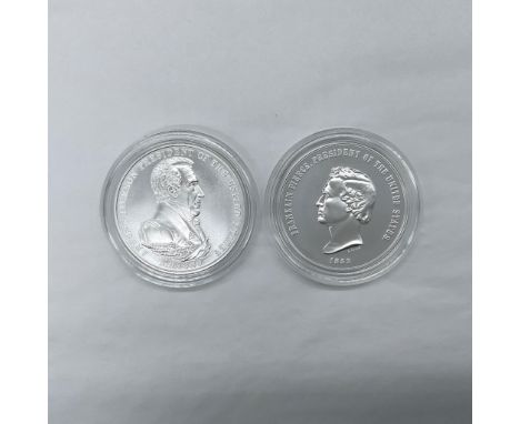 A collection of two 1 troy ounce silver medals. The collection includes Andrew Jackson: the obverse side features a side port