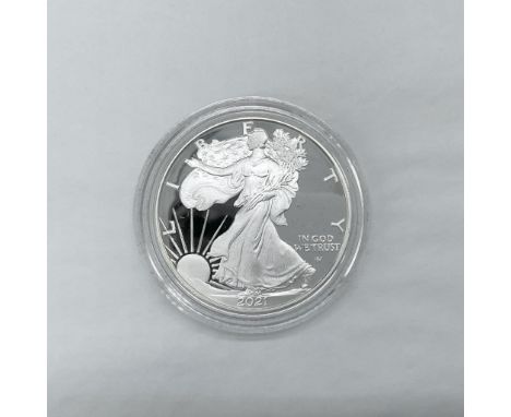 San Francisco Mint. The obverse side depicts Liberty in full stride. She is shown wrapped in the flag, her right hand is exte