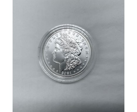 Denver Mint. The obverse side features Liberty in profile. She is shown in cap, flora, and crown. The reverse side depicts an