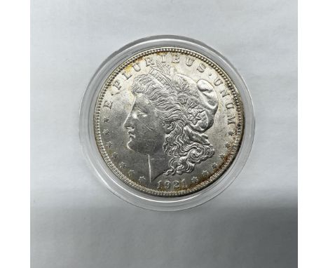 The obverse side features Liberty in profile. She is shown in cap, flora, and crown. The reverse side depicts an eagle with o