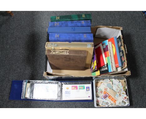 A box of stamp albums and Stanley Gibbons folders of stamps, first day covers etc 