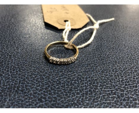 A 9ct gold and diamond half eternity ring 