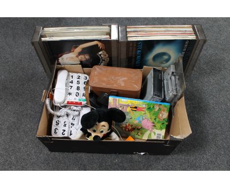 A box containing cine camera, car radio, big button telephones, vinyl LP's etc 
