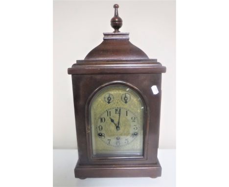 A German bracket clock on bun feet 