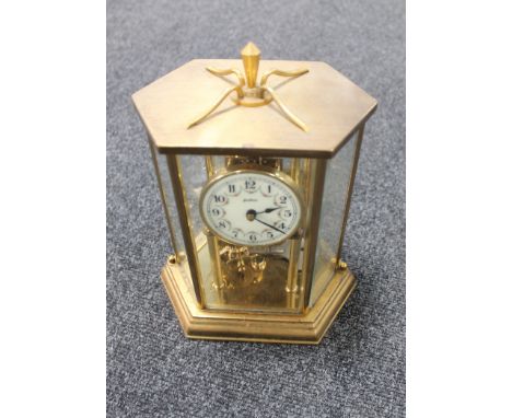 A brass cased Bentima anniversary clock with key 
