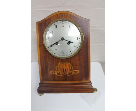 An early 20th century inlaid mahogany French mantel clock CONDITION REPORT: One foot loose. 