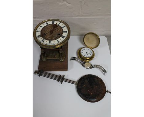 An antique brass and enamelled clock movement with pendulum together with a cased travel clock and a gent's Avia wristwatch 