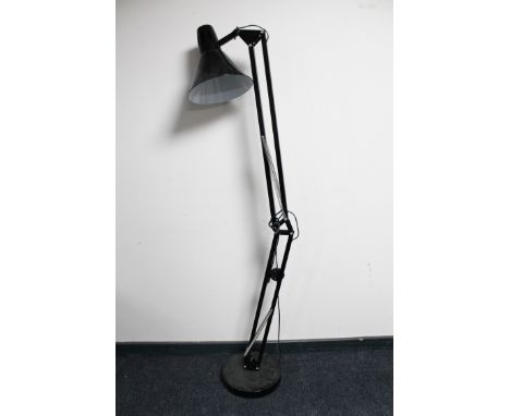 A black metal angle poise floor lamp (continental wiring)