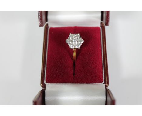 An 18ct gold and diamond cluster ring