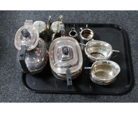 A tray containing a four piece Cross Arrows hard soldered plated tea service together with four other similar pieces 