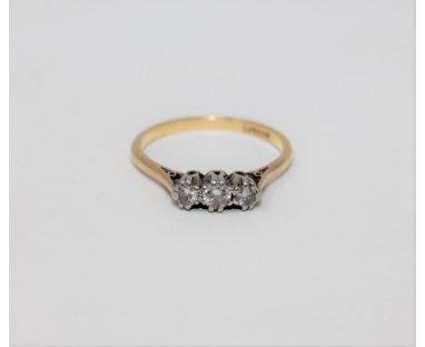 An 18ct and platinum set three stone diamond ring, approximately 0.25ct.