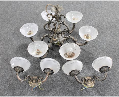 An ornate metal six way light fitting with glass shades together with a pair of double wall lights 