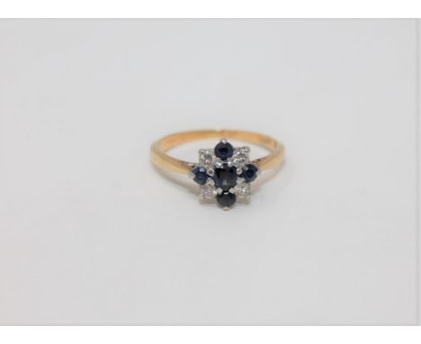 An 18ct gold and platinum set diamond and sapphire ring