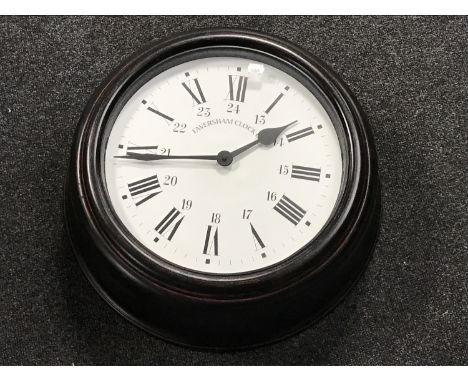 A contemporary 20 inch station style clock marked Faversham Clock Company 