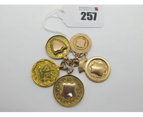 Five 9ct Gold Medallion Pendants, one engraved "R&amp;DFC 1930-31" the reverse detailed "Rotherham", another "R.&amp;.D.F.C. 