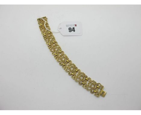 A Vintage Modernist Style Bracelet, gilt, of abstract textured design, to snap clasp, stamped "AMERIC", 18.6cm long. 