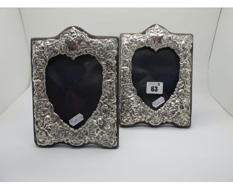 A Pair of Hallmarked Silver Mounted Photograph Frames, KFLd, London 1990, of antique style, detailed in relief, each with hea