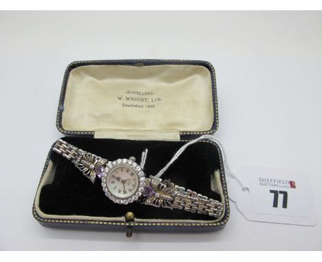 A Modern Brooks &amp; Bentley Ladies Hallmarked Silver Wristwatch, with mother of pearl dial and inset bezel, between butterf