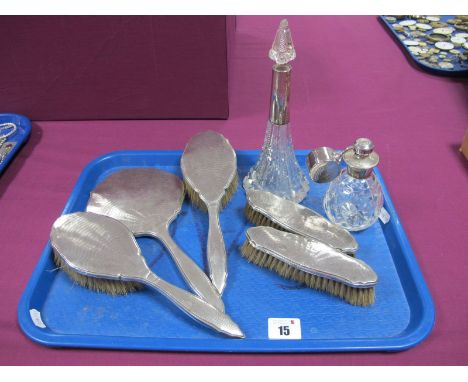 A Hallmarked Silver Backed Five Piece Dressing Table Set, with engine turned decoration; together with a hallmarked silver mo