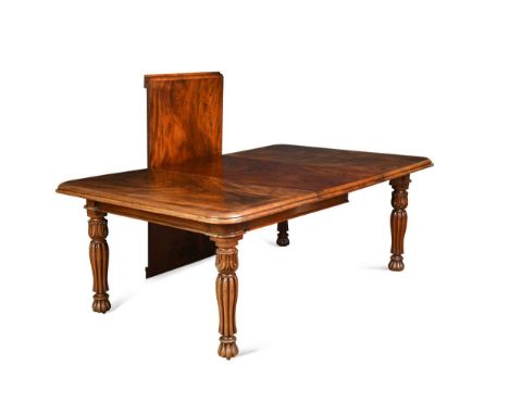 A William IV mahogany extending dining table, with two additional leaves, the rounded rectangular top over a plain frieze rai