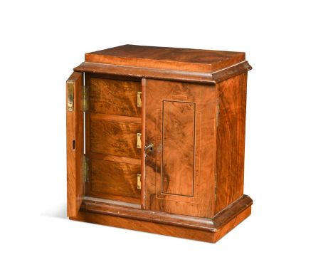 A miniature Victorian walnut chest, the pair of line inlaid doors enclosing a fitted interior with three compartmentalised dr