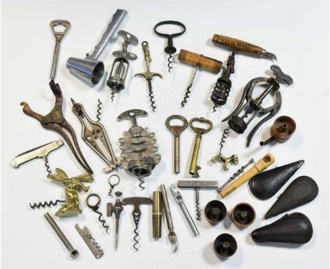 A collection of Victorian and later corkscrews, including a Daniel Crawford, Glasgow Finest very old Scotch Whiskey example, 
