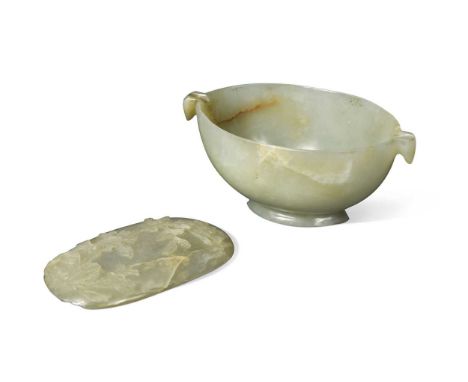 A Chinese jade small oval anointing/oil bowl, late Qing Dynasty, with stylised and grooved bird head shape end handles, on a 