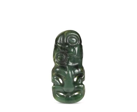A Māori Greenstone (Pounamu) Pendant (Hei Tiki), probably 18th/19th century, of typical embryonic form with tilted head, rece